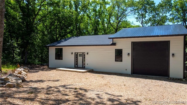 19580 Wonderland Rd, Rocky Mount, MO 65072 - single story home featuring dirt driveway and an attached garage