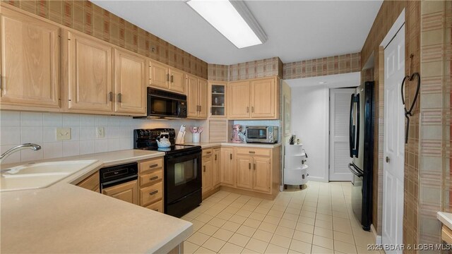 441 Northport Dr Unit 441, Lake Ozark, MO 65049 - kitchen with black appliances, a sink, light tile patterned floors, light brown cabinets, and light countertops
