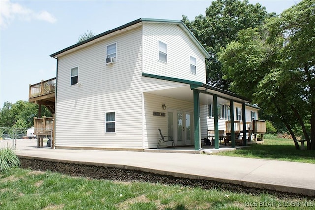 1025 Crystal Springs Rd, Linn Creek, MO 65052 - back of house featuring french doors, a patio area, and cooling unit