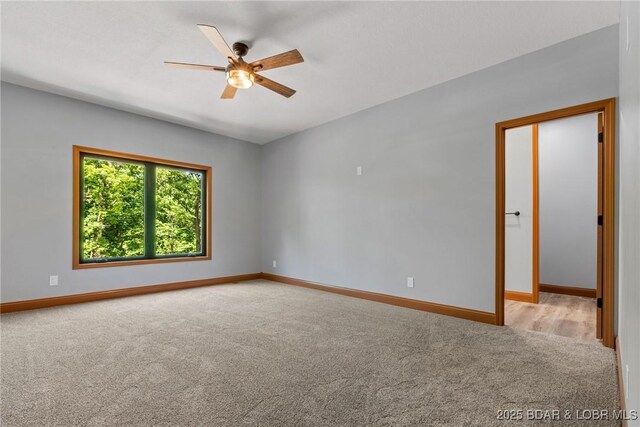 55 Turn Bridge Ln, Porto Cima, MO 65079 - empty room with carpet flooring, a ceiling fan, and baseboards