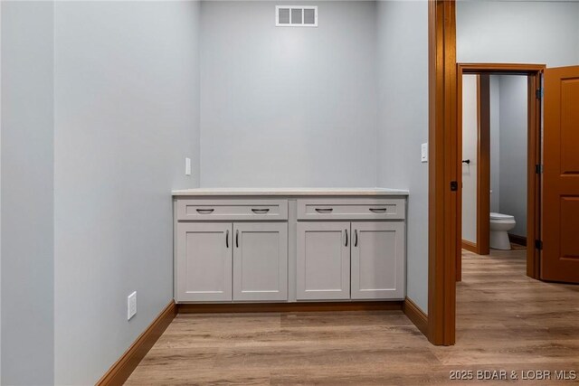 55 Turn Bridge Ln, Porto Cima, MO 65079 - detailed view of wood finished floors and baseboards