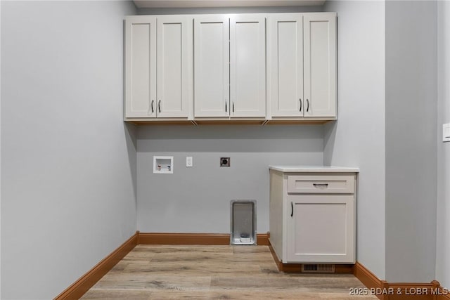 55 Turn Bridge Ln, Porto Cima, MO 65079 - laundry area with hookup for an electric dryer, cabinet space, washer hookup, light wood-style floors, and baseboards