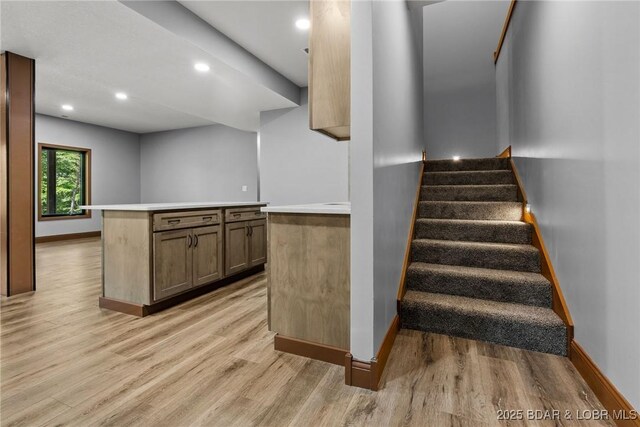 55 Turn Bridge Ln, Porto Cima, MO 65079 - stairway with wood finished floors, baseboards, and recessed lighting