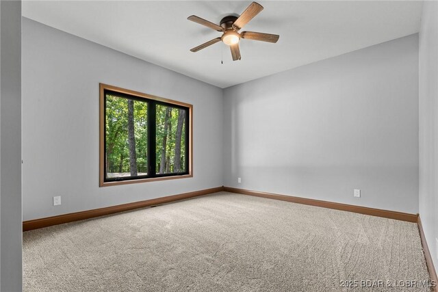 55 Turn Bridge Ln, Porto Cima, MO 65079 - carpeted spare room featuring baseboards and ceiling fan