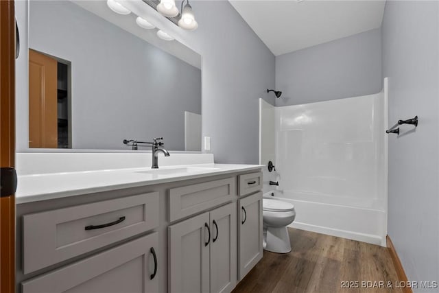 55 Turn Bridge Ln, Porto Cima, MO 65079 - full bath with toilet, vanity, wood finished floors, and washtub / shower combination