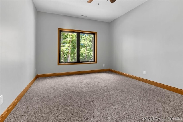 55 Turn Bridge Ln, Porto Cima, MO 65079 - spare room with ceiling fan, carpet flooring, and baseboards