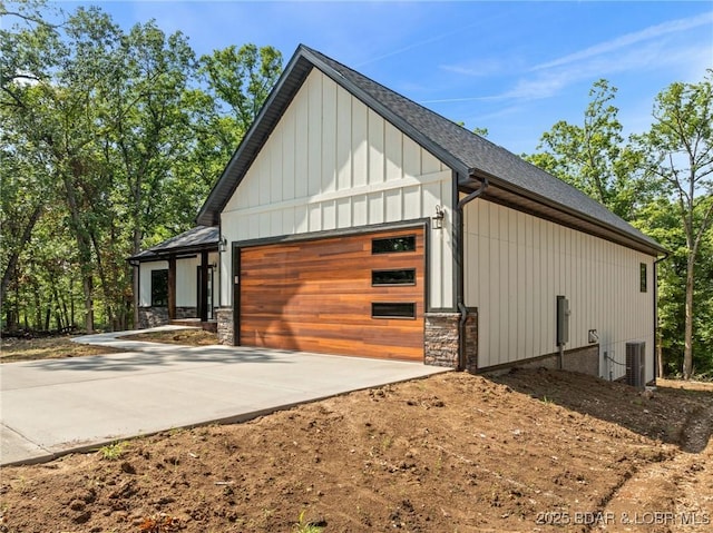 55 Turn Bridge Ln, Porto Cima, MO 65079 - garage with driveway and central AC