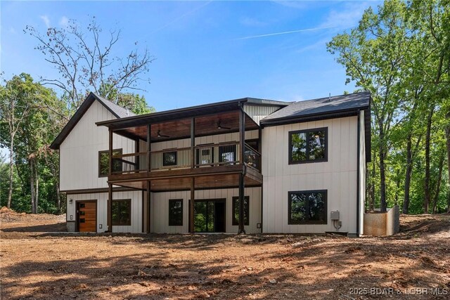 55 Turn Bridge Ln, Porto Cima, MO 65079 - back of house with a ceiling fan, a deck, and an attached garage