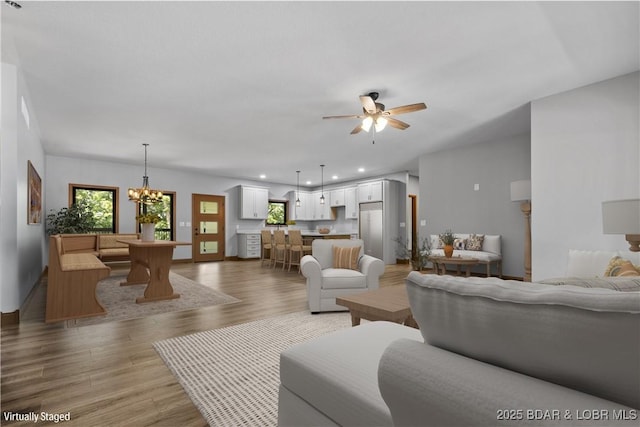 55 Turn Bridge Ln, Porto Cima, MO 65079 - living area featuring light wood-type flooring, ceiling fan, recessed lighting, and a chandelier