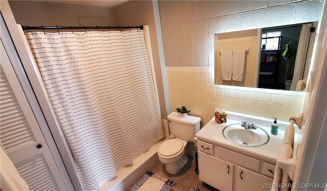 44 Port Bagnell Rd, Eldon, MO 65026 - full bathroom featuring toilet, tile walls, vanity, tile patterned floors, and a shower with curtain