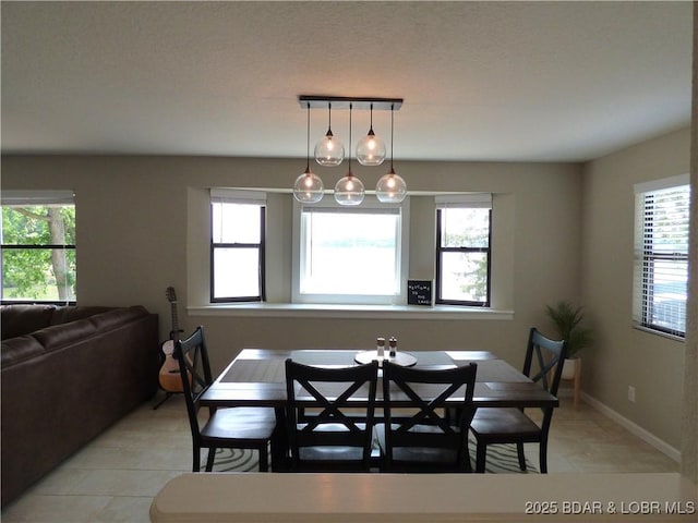 44 Port Bagnell Rd, Eldon, MO 65026 - dining area with light tile patterned floors and baseboards