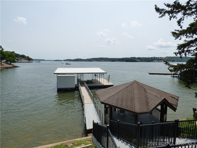 44 Port Bagnell Rd, Eldon, MO 65026 - dock area featuring a water view and boat lift