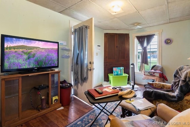413 E 3rd St, Eldon, MO 65026 - living area with wood finished floors and a paneled ceiling