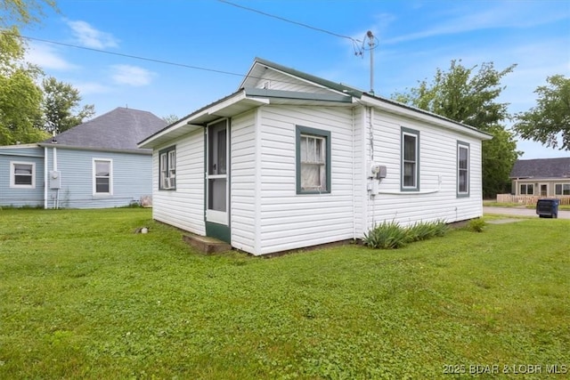 413 E 3rd St, Eldon, MO 65026 - view of side of property with a lawn