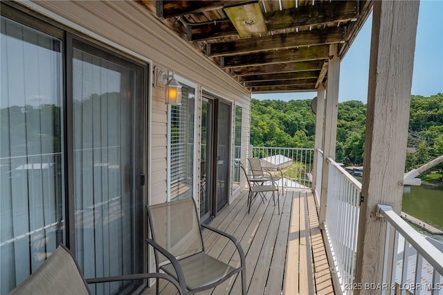 28 Wheel House Cir Unit A-4, Four Seasons, MO 65049 - balcony featuring a view of trees