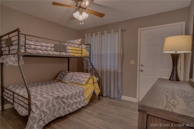 28 Wheel House Cir Unit A-4, Four Seasons, MO 65049 - bedroom featuring wood finished floors, baseboards, and ceiling fan