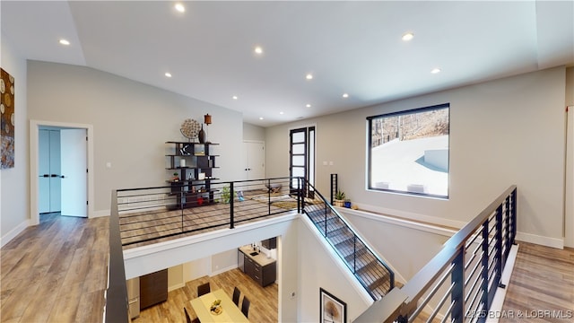 481 Comanche Rd, Lake Ozark, MO 65049 - staircase featuring wood finished floors, recessed lighting, and baseboards