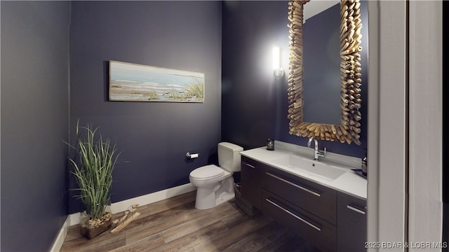 481 Comanche Rd, Lake Ozark, MO 65049 - half bath with toilet, vanity, wood finished floors, and baseboards