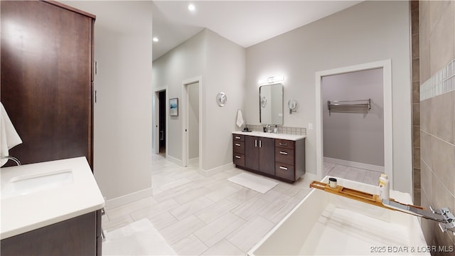 481 Comanche Rd, Lake Ozark, MO 65049 - full bathroom featuring two vanities, recessed lighting, and baseboards