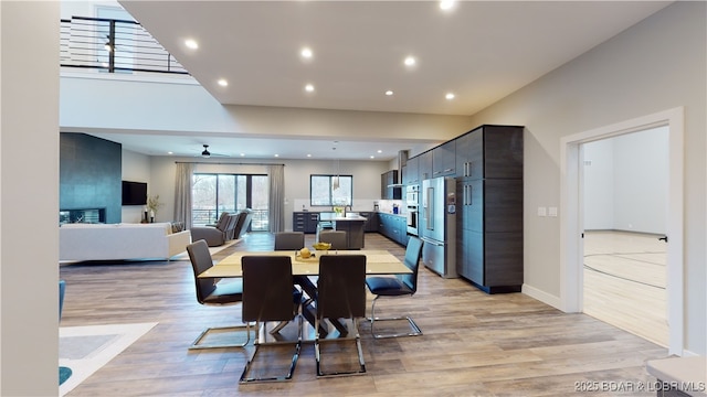 481 Comanche Rd, Lake Ozark, MO 65049 - dining space featuring light wood finished floors, recessed lighting, a ceiling fan, and baseboards