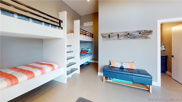 481 Comanche Rd, Lake Ozark, MO 65049 - bedroom featuring baseboards and a towering ceiling