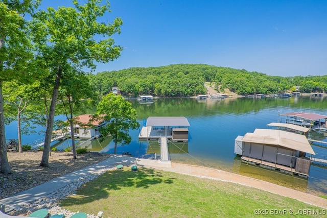 481 Comanche Rd, Lake Ozark, MO 65049 - dock featuring a water view and a forest view
