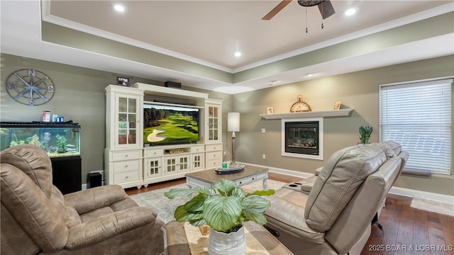 149 Snead Cir, Lake Ozark, MO 65049 - living area featuring wood-type flooring, baseboards, ceiling fan, crown molding, and a glass covered fireplace