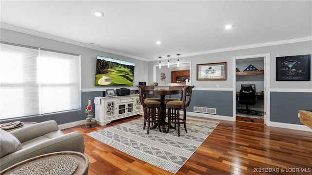 149 Snead Cir, Lake Ozark, MO 65049 - dining area with wood finished floors, ornamental molding, baseboards, and recessed lighting