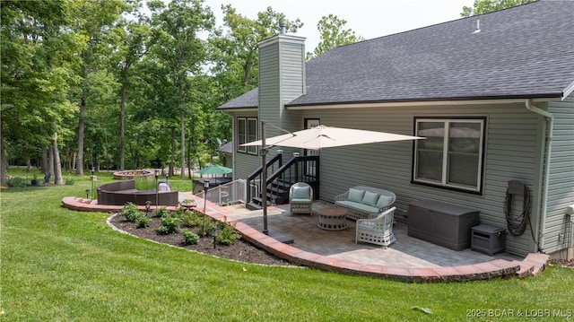 149 Snead Cir, Lake Ozark, MO 65049 - rear view of property with a patio, a yard, a chimney, a shingled roof, and an outdoor living space