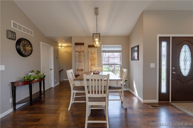 4715 Inlet Ln, Osage Beach, MO 65065 - dining room featuring vaulted ceiling, baseboards, and dark wood-style flooring