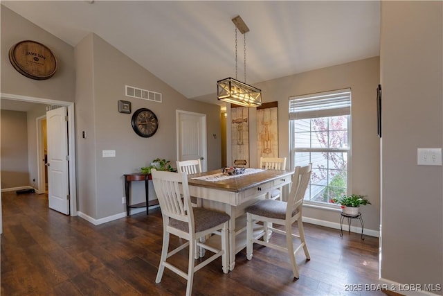4715 Inlet Ln, Osage Beach, MO 65065 - dining room with dark wood-style flooring, vaulted ceiling, and baseboards