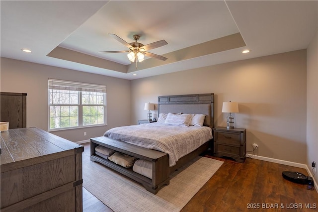 4715 Inlet Ln, Osage Beach, MO 65065 - bedroom featuring a raised ceiling, baseboards, recessed lighting, a ceiling fan, and dark wood-type flooring