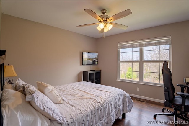4715 Inlet Ln, Osage Beach, MO 65065 - bedroom with baseboards, wood finished floors, and a ceiling fan
