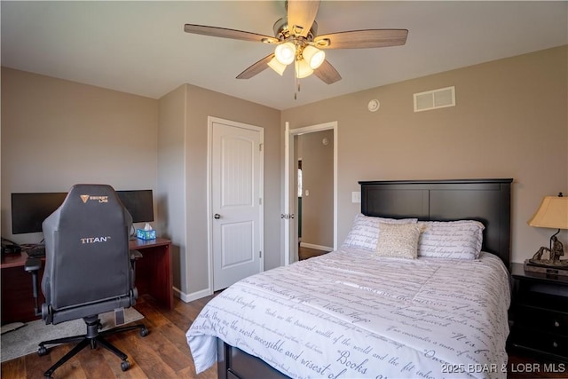 4715 Inlet Ln, Osage Beach, MO 65065 - bedroom with wood finished floors, a desk, baseboards, and a ceiling fan