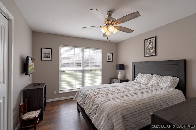 4715 Inlet Ln, Osage Beach, MO 65065 - bedroom with dark wood finished floors, baseboards, and ceiling fan