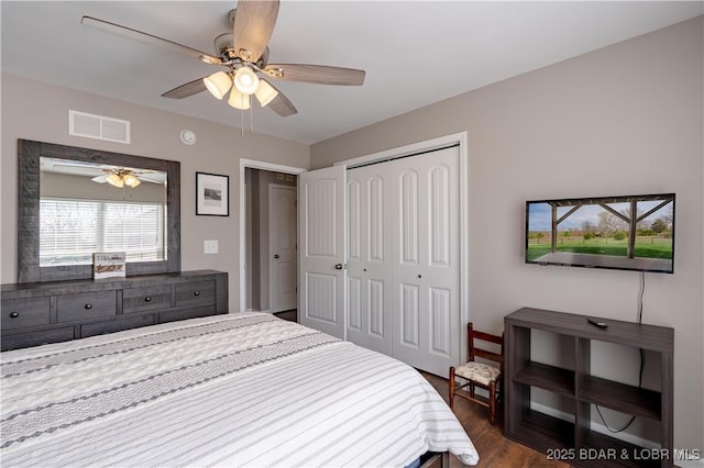 4715 Inlet Ln, Osage Beach, MO 65065 - bedroom featuring dark wood-style floors, a closet, and a ceiling fan