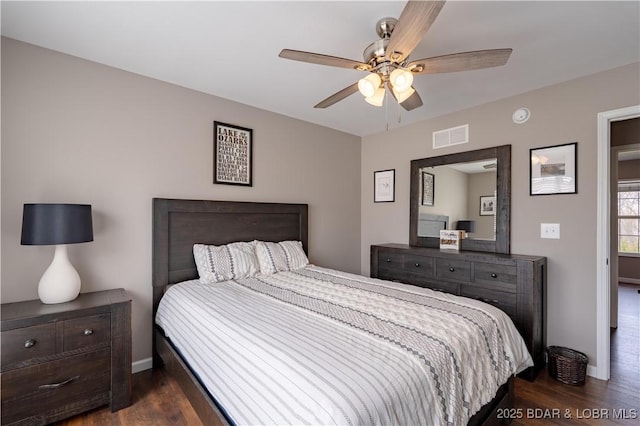 4715 Inlet Ln, Osage Beach, MO 65065 - bedroom featuring dark wood-type flooring, baseboards, and a ceiling fan