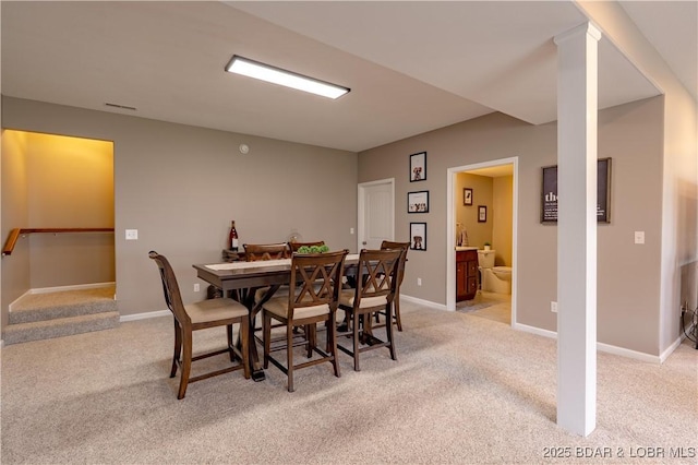 4715 Inlet Ln, Osage Beach, MO 65065 - dining area with light carpet and baseboards