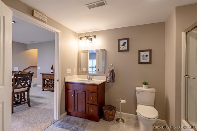 4715 Inlet Ln, Osage Beach, MO 65065 - full bath featuring vanity, toilet, a shower with door, and baseboards