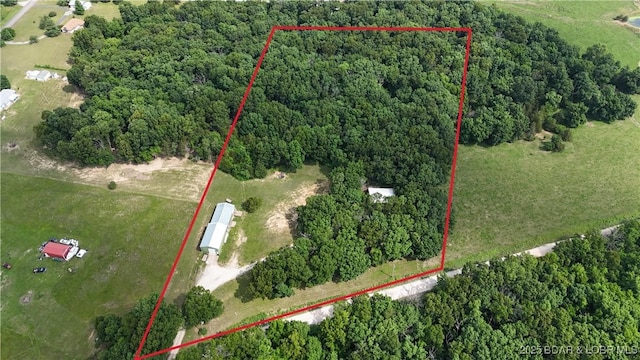 13 Bunker Rd, Eldon, MO 65026 - aerial view of property's location with a heavily wooded area and property boundaries highlighted