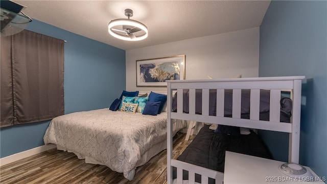 4897 Bridgepoint Dr Unit 311, Osage Beach, MO 65065 - bedroom featuring wood finished floors and baseboards