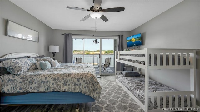 4897 Bridgepoint Dr Unit 311, Osage Beach, MO 65065 - bedroom with wood finished floors, access to outside, and a ceiling fan