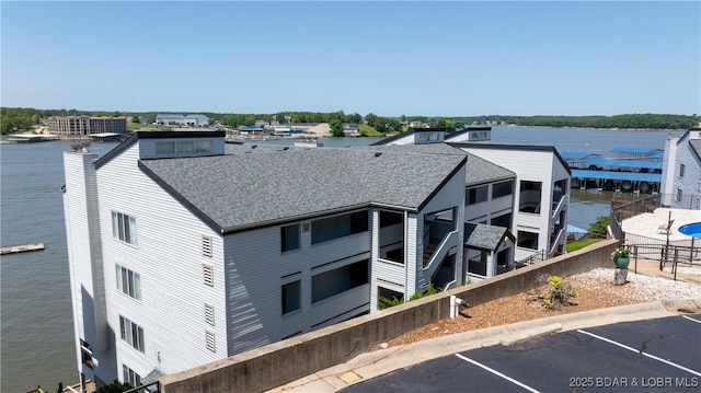 4897 Bridgepoint Dr Unit 311, Osage Beach, MO 65065 - view of property with uncovered parking and a water view