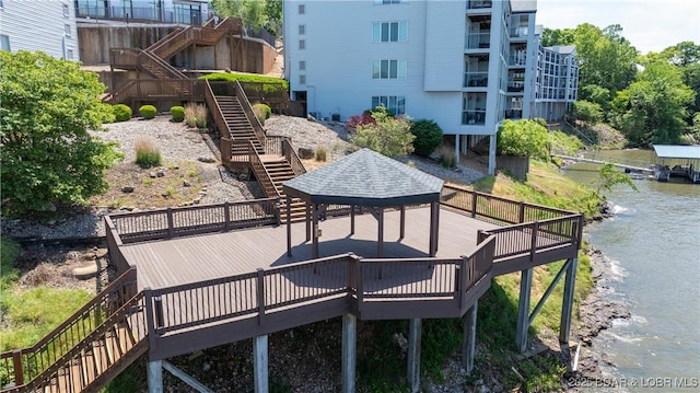 4897 Bridgepoint Dr Unit 311, Osage Beach, MO 65065 - view of home's community featuring stairs, a deck with water view, and a gazebo
