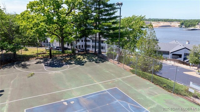 4897 Bridgepoint Dr Unit 311, Osage Beach, MO 65065 - view of sport court with a water view and community basketball court