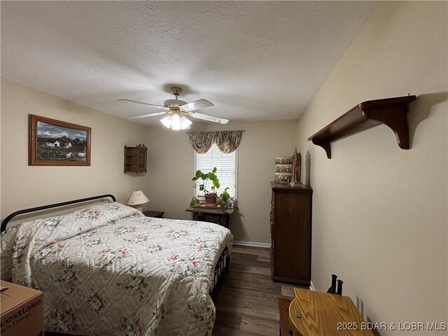 1001 Ha Ha Tonka Rd, Camdenton, MO 65020 - bedroom with dark wood finished floors, ceiling fan, a textured ceiling, and baseboards
