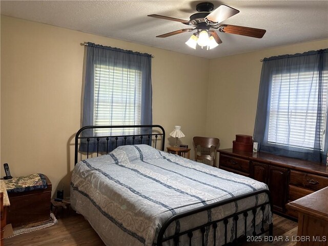1001 Ha Ha Tonka Rd, Camdenton, MO 65020 - bedroom with wood finished floors and a ceiling fan