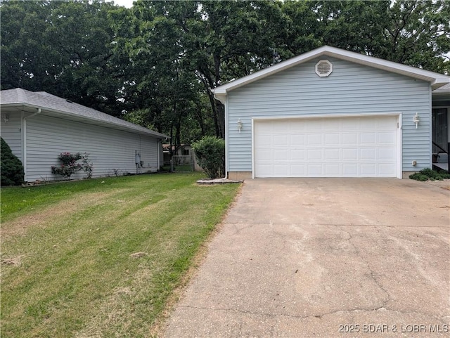 1001 Ha Ha Tonka Rd, Camdenton, MO 65020 - garage with concrete driveway and view of wooded area