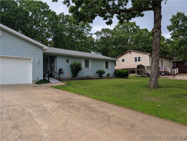 1001 Ha Ha Tonka Rd, Camdenton, MO 65020 - ranch-style home with an attached garage, a front yard, and driveway
