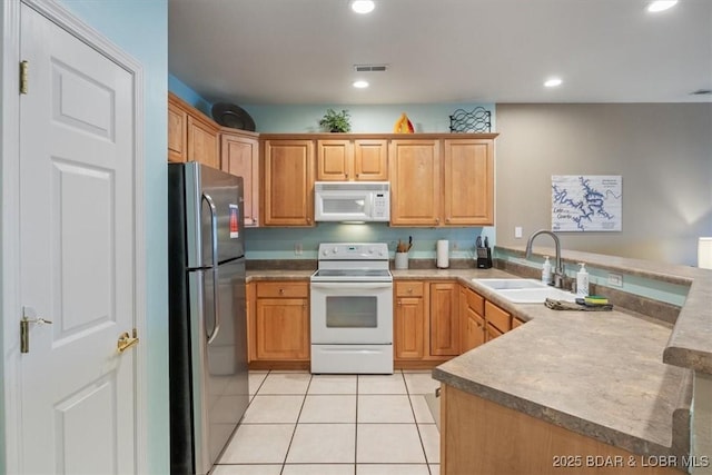 1181 Jeffries Rd Unit B107, Osage Beach, MO 65065 - kitchen featuring white appliances, a sink, light tile patterned floors, recessed lighting, and a peninsula
